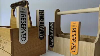 Bespoke reserved signs for tables with condiment holder